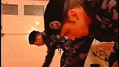 A very bad cadet is taken into the latrine and has to eat meat and ass fuck